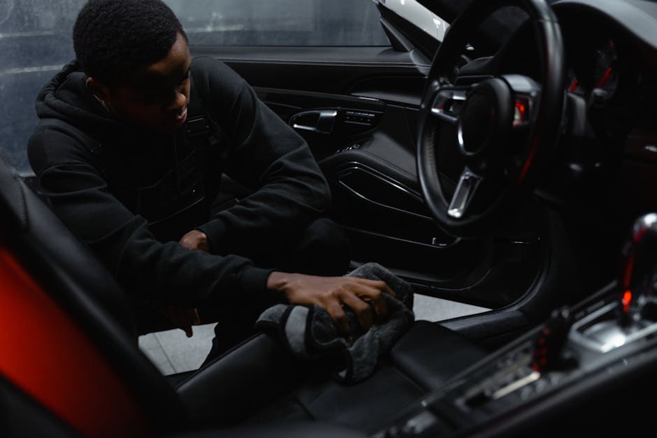 Detailed interior cleaning of a luxury vehicle